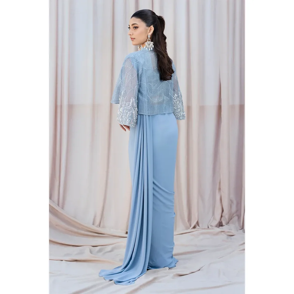 Back View "Back view of the Sky Blue Fusion Saree showing the flowing organza cape and elegant hand-embellished details."