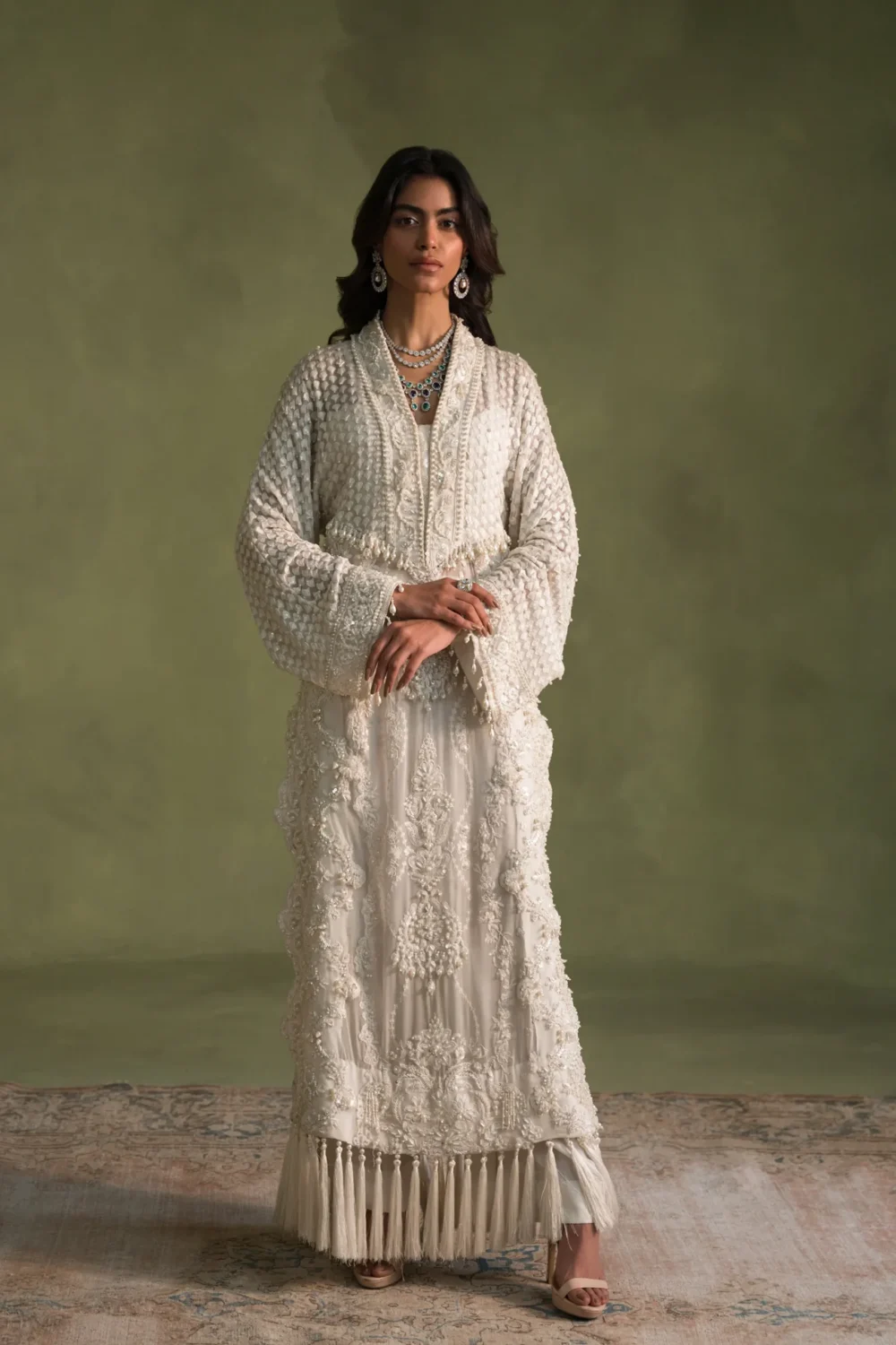 White dress knee-length with intricate embroidery details
