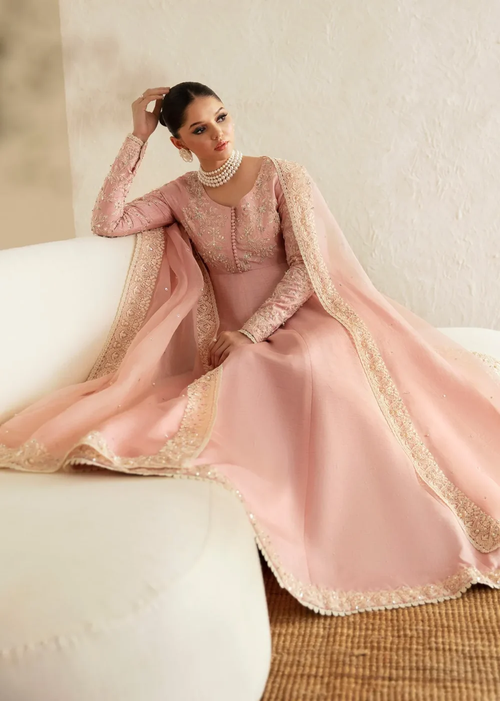 "Blush pink pishwas with intricate embroidery and hand embellishments"