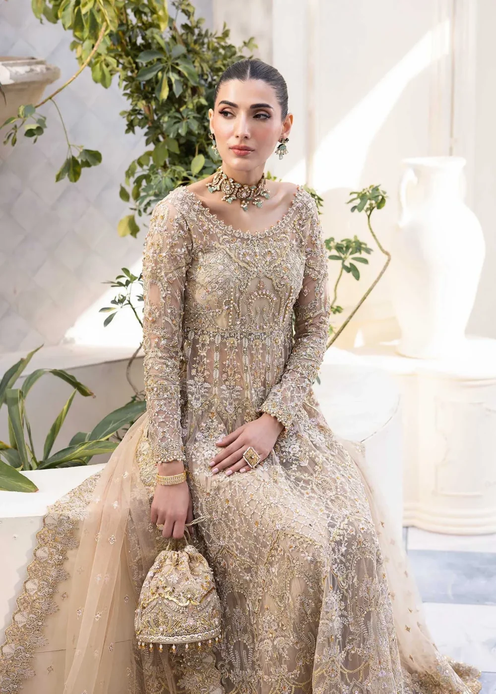 Nude Peshwas ensemble with delicate embroidery and shimmering embellishments