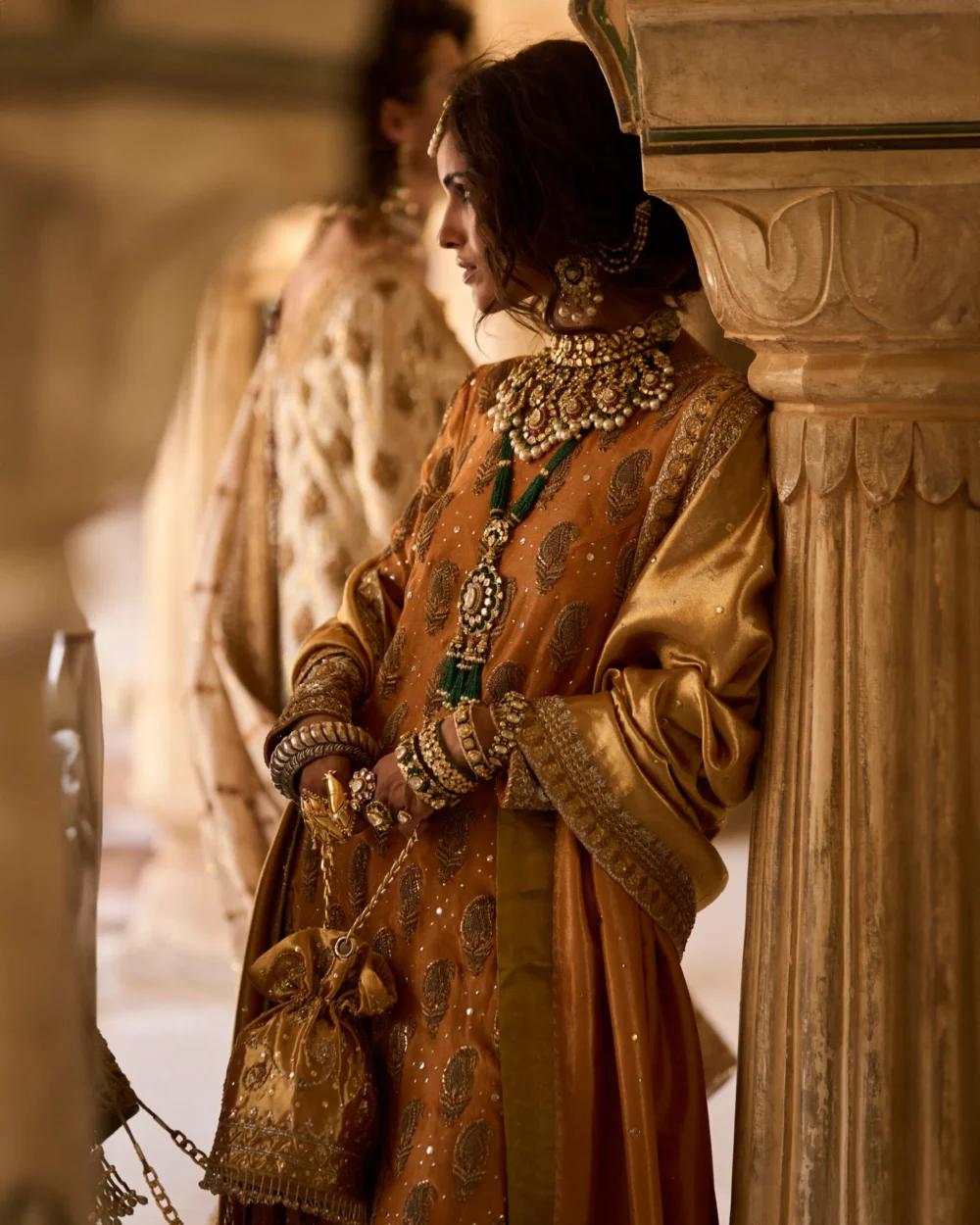 Mustard & Olive Ensemble featuring a pure mysori net shirt with zardozi work, olive green jamavar dhaka pajama, and mustard lamè tissue dupatta.